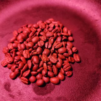 Photo of a pile of two hundred coffee beans, representing a single donation of two hundred dollars yearly.