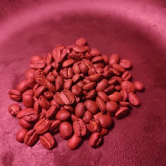 Photo of a pile of one hundred and fifty coffee beans, representing a single donation of one hundred and fifty dollars yearly.